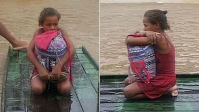 FOTOS: Fugindo da enchente, menina pernambucana escolhe salvar livros e comove as redes